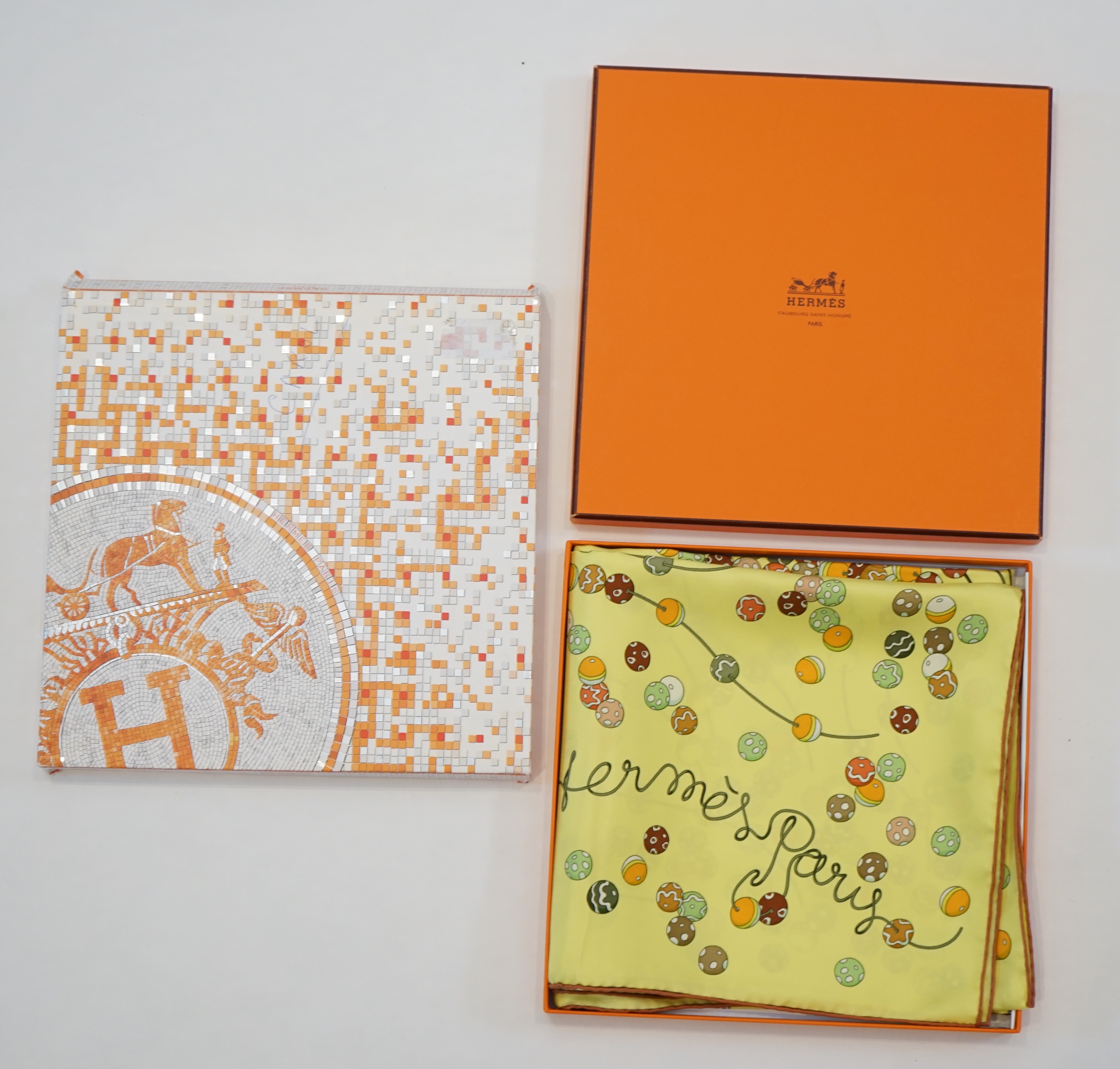A yellow Hermès 'Dancing Pearls' silk scarf designed by Virginie Jamin, 90cm x 90cm